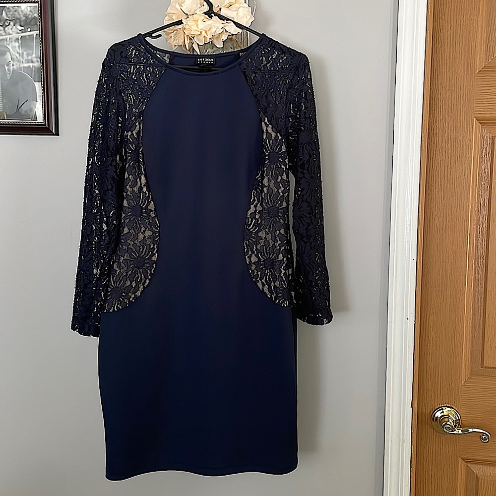 I am selling a Navy Blue Dress worn one once.